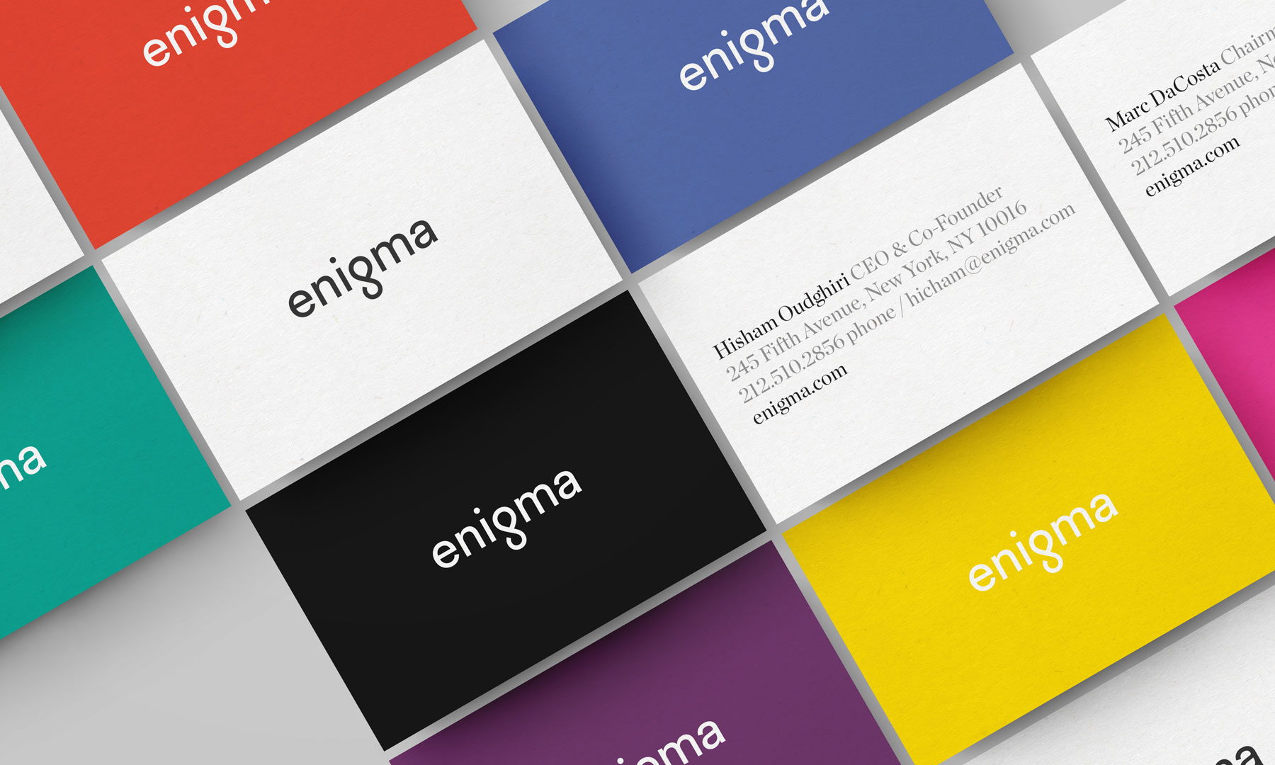 array of Enigma business cards in multiple colors