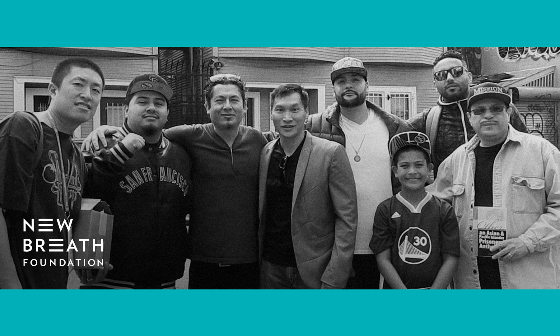 photo of Eddy Zheng and others framed with New Breath Foundation color and logo